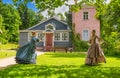 Women in vintage dresses play hoops