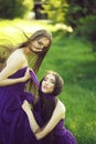 Women in violet dresses Royalty Free Stock Photo