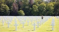 Women walking between graves in the American mlitary cemetary in Luxembourg Royalty Free Stock Photo