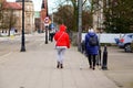 Women walking on a sidewalk.