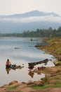 Women washing clothes in the Mekong River in Laos, Asia Royalty Free Stock Photo