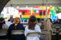Women watch a stage performance at Pride Fest