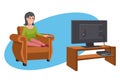 Women watching TV on sofa. Evening watching television series. Interior of the room with TV and people sitting on the couch.