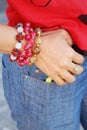 Women wearing bracelet and jewelry with jeans.