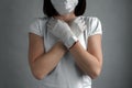 Women wearing protection face mask and gloves against coronavirus. White clothes and gloves.