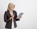 women wearing suits hijab happy working with the tablet formal work concept