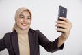 women wearing suits hijab selfie with the phone, formal work concept