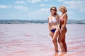 Women wearing swimsuits posing at the salt lake Royalty Free Stock Photo