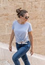 Women wearing t-shirt and jeans going up the stairs Royalty Free Stock Photo