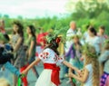 Women wearing ukrainian clothes with embroidered flowers celebrating pagan holiday of Ivan Kupala, back view