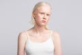 Women with white skin wearing camisole having strange face expression Royalty Free Stock Photo