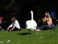 Women and a white swan