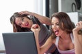 Women win online with laptop