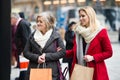 Women window shopping in centre of the city. Winter Royalty Free Stock Photo