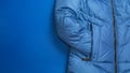 women winter concept. autumn and winter fashion woman\'s outfit. jacket on blue background Royalty Free Stock Photo