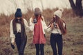 Women in a winter park without snow with thermos and tea Royalty Free Stock Photo