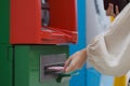 Women withdraw cash from ATM