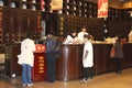 Women at work in an antique and rustic pharmacy in Hangzhou, China
