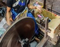 Women work in an old loom weaving cooperative in Kannur, and spinning wheel (Charkha), Kerala, India