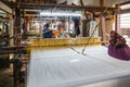 Women work in an old loom weaving cooperative in Kannur, Kerala, India