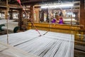 Women work in an old loom weaving cooperative in Kannur, Kerala, India