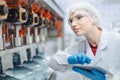 Women worker work in drink water factory inspect check quality drinking water filling machine control operate Royalty Free Stock Photo