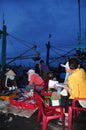 Women workers are collecting and sorting fisheries into baskets after a long day fishing in the Hon Ro seaport, Nha Trang city Royalty Free Stock Photo