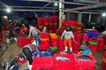 Women workers are collecting and sorting fisheries into baskets after a long day fishing in the Hon Ro seaport, Nha Trang city Royalty Free Stock Photo