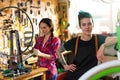 Women working in a bicycle repair shop Royalty Free Stock Photo