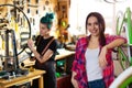 Women working in a bicycle repair shop Royalty Free Stock Photo