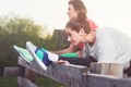 Women working stretching leg muscles of back to warm up street staining. Preparation for running workout. Royalty Free Stock Photo