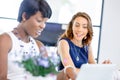 Women working together, office interior Royalty Free Stock Photo