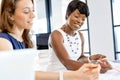 Women working together, office interior Royalty Free Stock Photo