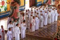 Women worshippers praying at the temple of Cao Dai