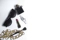 Women's accessories in black and cosmetics on a white background. Top view of the desktop for women Royalty Free Stock Photo