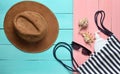 Women& x27;s clothing and accessories for relaxation on the beach on a wooden pastel background. Beach bag, sunblock Royalty Free Stock Photo