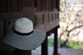 Women& x27;s fashion hats on Thai wooden houses, pastel background