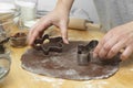 Women& x27;s hands cooking festive Christmas gingerbread cookies. Cooking chocolate cookies or dessert Royalty Free Stock Photo