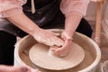 Women& x27;s hands create dishes on a potter& x27;s electric wheel. Royalty Free Stock Photo