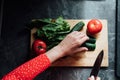 women& x27;s hands cut vegetables cucumbers tomatoes salad healthy food Royalty Free Stock Photo