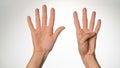 Women& x27;s hands gesture counting on fingers nine palm side