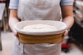 Women& x27;s hands hold the dough before putting it in the oven. Close-up of baker& x27;s hands Royalty Free Stock Photo