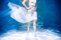 Women's health concept. Girl underwater in white. lightness, freshness and health