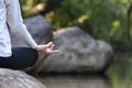 Women yoga in nature near river