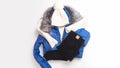 Womens blue jacket with fur collar with warm knitted hat and scarf, trousers isolated on white background