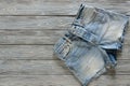 Womens clothing denim shorts on grey wooden background with co