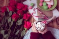 Winter breakfast with red rose and heart of striped lollipop Royalty Free Stock Photo