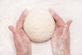 Womens hands, flour and dough. A woman is preparing a dough for home baking.