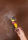 Womens hands holding a smoking smudge stick to banish bad energy. Dried herbs and flowers are tied into a bundle with a Royalty Free Stock Photo
