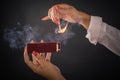 Womens hands ignite big matches for a tompus cigare or a fireplace Royalty Free Stock Photo